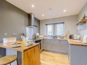 a large kitchen with a counter top and a sink at 1 Bed in Colne oc-86513 in Rawdon