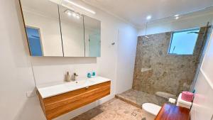 a bathroom with a sink and a shower at Galley Cove House in Geographe +28 photos
