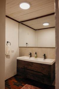 a bathroom with a sink and a large mirror at Finca Agrreste in Nemocón +130 photos