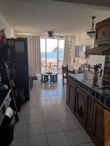 a kitchen with a view of the ocean at Mision del Sol 302 in Bahía Kino