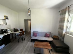 a living room with a couch and a table at Casa Verde in Marathias