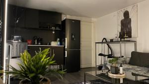 a living room with a couch and a table at Boutique apartment in Strömstad in Strömstad