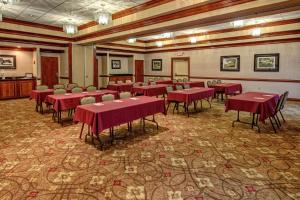 a conference room with red tables and chairs in it at Hampton Inn Winchester KY in Winchester +29 photos
