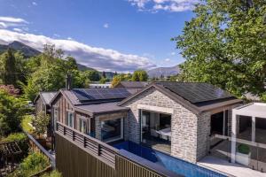an image of a house with solar panels on the roof at The Spire Hotel in Queenstown