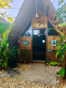a house with a door in the middle at MyLove Siargao Village in General Luna +16 photos