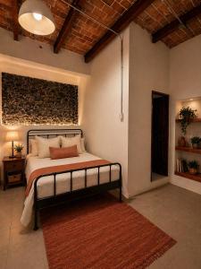 a bedroom with a bed in a room at Morada Luna Centro Histórico in Mexico City