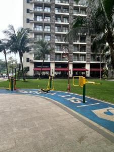 an empty playground in a park with swings at Kawoeng skyhouse BSD in Cilenggang