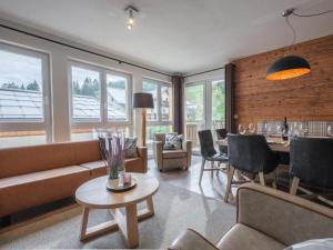 a living room with a couch and a table at Emma Top 1 in Dienten am Hochkönig