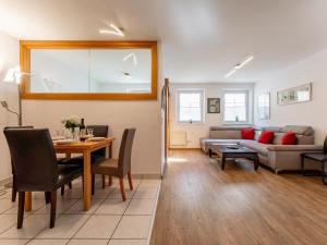 a living room with a table and a couch at Selmas in Zell am See