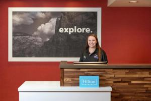 a woman standing at a podium in a room at Hampton Inn Phoenix-Chandler in Chandler +15 photos