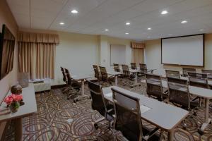 a conference room with tables and chairs and a screen at Hampton Inn Richmond-West Innsbrook in Broad Meadows +34 photos