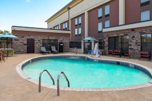 a large swimming pool in front of a building at Hampton Inn South Hill in South Hill
