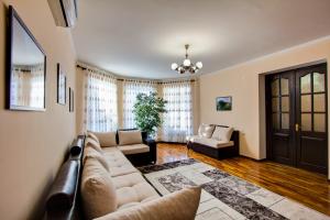 a living room with a couch and a table at Centre hostel in Bishkek