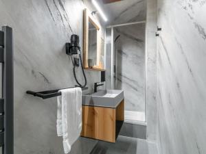 a bathroom with a sink and a mirror at Bergzeit Hollersbach L in Hollersbach im Pinzgau