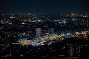 a view of a city at night with lights at Altos de Colombo Guest House Boutique - Soft Opening in Rio de Janeiro