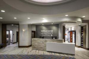 a lobby of a hotel with a white reception desk at Hampton Inn Washington DC - Convention Center in Washington, D.C.
