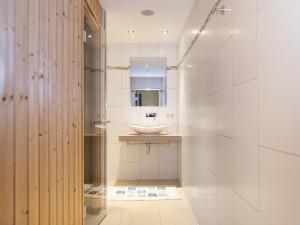 a bathroom with a sink and a mirror at Apartment Gartentraum in Itter