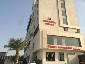 a building with a sign on the side of it at Chandra Grand in Jodhpur
