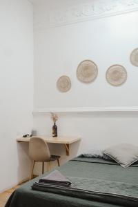 a bedroom with a bed and a desk with a chair at U-CO Live Roma Norte in Mexico City +76 photos
