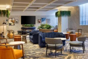 a lobby with furniture and a flat screen tv at Hilton Leeds City in Leeds +91 photos
