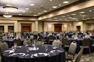 a banquet hall with tables and chairs in a room at Embassy Suites Lexington in Lexington +61 photos
