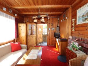 a living room with a couch and a table at Chalet Westermeyr in Mieming