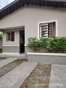 a white house with a window and plants at Jadash house in David