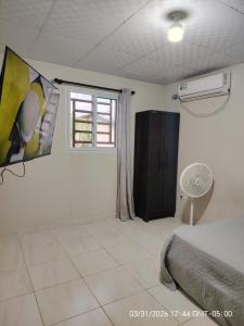 a bedroom with a bed and a window at Jadash house in David