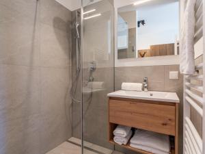 a bathroom with a sink and a shower at Grebenzen Lodge 1028 in Sankt Lambrecht +82 photos