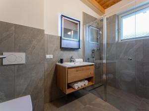 a bathroom with a sink and a shower at Mountain Chalet Esttes in Sankt Lorenzen ob Murau +62 photos