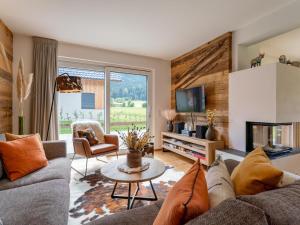 a living room with a couch and a fireplace at Mountain Vista in Sankt Lorenzen ob Murau