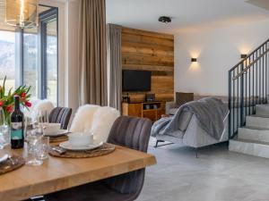 a living room with a table and chairs at Mountain Chalet Esttes in Sankt Lorenzen ob Murau