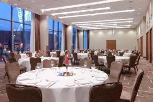a banquet room with tables and chairs and windows at Hilton Liverpool City Centre in Liverpool +56 photos