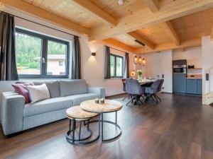 a living room with a couch and a table at Obermöschach 6 in Obermöschach