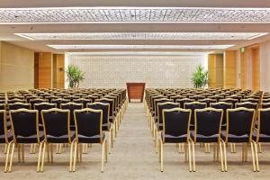 a room with rows of chairs and a podium at Hilton Luxor Resort & Spa in Luxor +146 photos