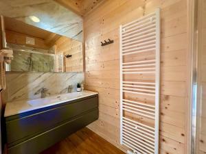 a bathroom with a sink and a mirror at Rattendorf 1A in Rattendorf +57 photos