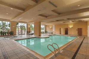 a pool in the lobby of a hotel at Embassy Suites by Hilton Portland Airport in Portland