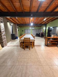 a large room with a table and chairs in it at La tota casa de campo in Pocito