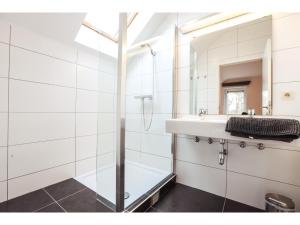 a bathroom with a shower and a sink and a mirror at The Green in Durbuy +31 photos