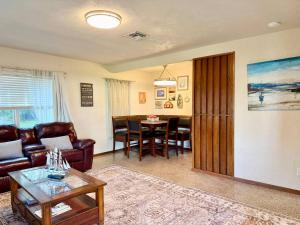 a living room with a couch and a table at Downtown Duplex A Amazing Location in Sanford
