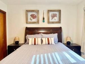a bedroom with a large bed with two night stands at Downtown Duplex A Amazing Location in Sanford