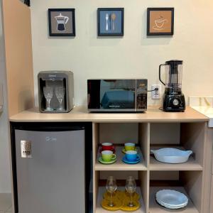 a kitchen with a counter with a microwave and a blender at VR VILLAGE - APT 02 - Studio completo próximo ao Shopping da Ilha in São Luís +19 photos