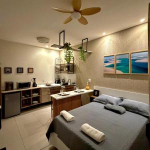 a bedroom with a bed and a sink in it at VR VILLAGE - APT 02 - Studio completo próximo ao Shopping da Ilha in São Luís