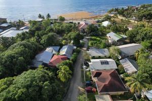 an aerial view of a small village next to the ocean at Blue Paradise in Coxen Hole