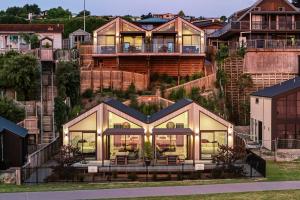 a house on the side of a building at Roam Taupo Lakefront Combined Units 3&4 in Taupo