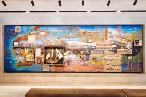 a large mural on the wall of a museum at Parmelia Hilton Perth in Perth