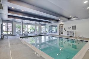 a swimming pool in a building at DoubleTree by Hilton Raleigh-Cary in Cary