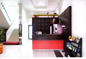 a store with a red counter in a room at Yasminstar Hotel in Muntok