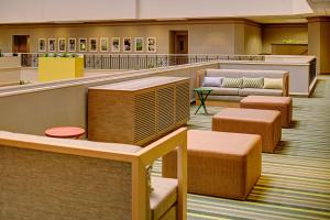 a waiting room with couches and tables in a building at Embassy Suites by Hilton San Diego Bay Downtown in San Diego +56 photos