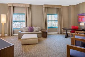 a living room with a couch and a table at Embassy Suites by Hilton San Diego Bay Downtown in San Diego